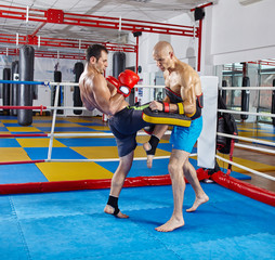 Kickbox fighters training in the ring