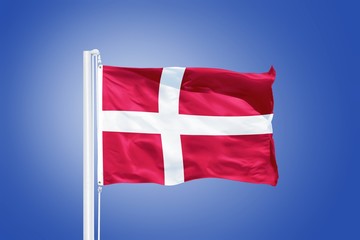 Flag of Denmark flying against a blue sky