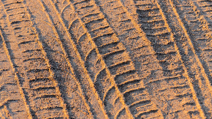 tire tracks in the sand