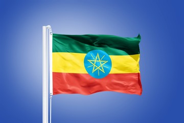 Flag of Ethiopia flying against a blue sky