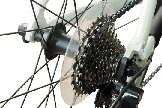 Rear mountain bike cassette on the wheel with chain on white bac