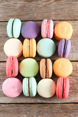 French colorful and tasty macarons on grey wooden table