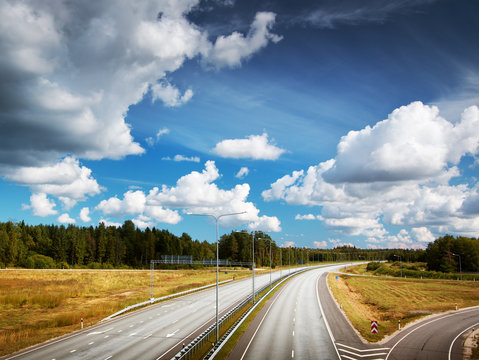 Motorway in summer with beautiful clouds