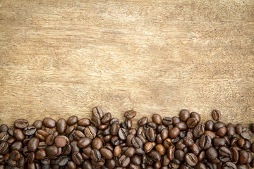 Roasted coffee beans on wooden 