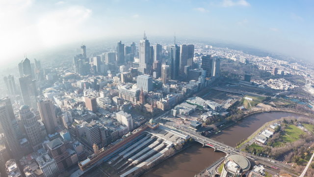 Timelapse video of downtown Melbourne in Australia, camera zooming in, aerial fisheye view