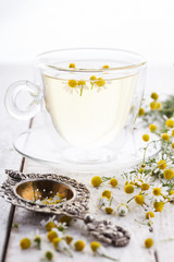 Obraz na płótnie Canvas Chamomile tea in a glass Cup,therapeutic.