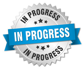 in progress 3d silver badge with blue ribbon