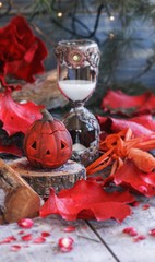 pumpkin on a background of dry plants and candles