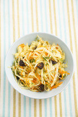 Cabbage with carrot, herbs and prunes