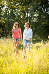 Fototapeta premium Mother and teenage daughter walk in nature