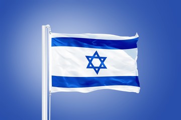 Flag of Israel flying against a blue sky