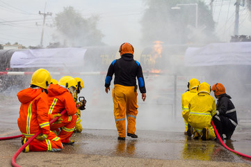 Firefighters extinguish oil train.