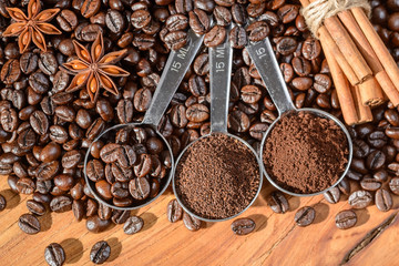 coffee beans and powder in the spoon, top view