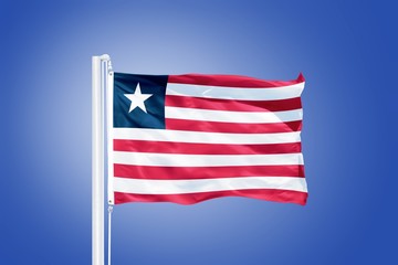 Flag of Liberia flying against a blue sky