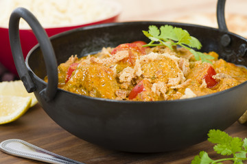 Karahi Gosht - Mutton curry cooked with tomatoes and topped with fried onions. Served with naan bread, pilau rice and poppadoms.
