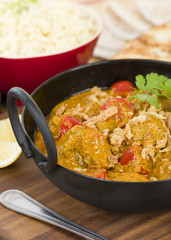 Karahi Gosht - Mutton curry cooked with tomatoes and topped with fried onions. Served with naan bread, pilau rice and poppadoms.
