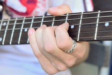Fototapeta na wymiar guitarist playing guitar closeup
