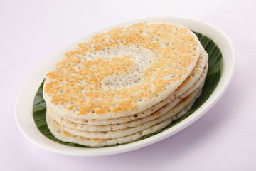 Stack of South Indian breakfast dosas.