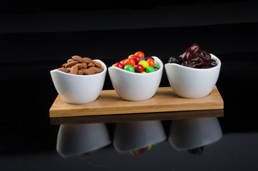 almond, chocolate and date on a background