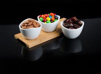 almond, chocolate and date on a background