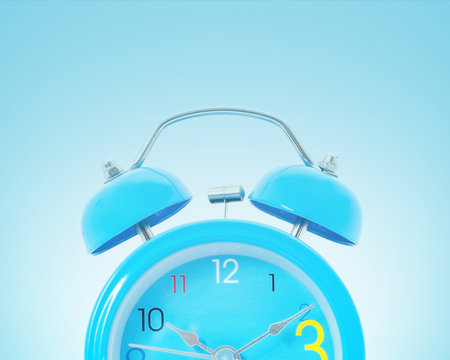 Alarm clock on blue background.