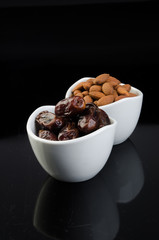 dates and almonds on a background