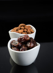 dates and almonds on a background