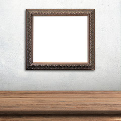 Old picture frame on white wall.