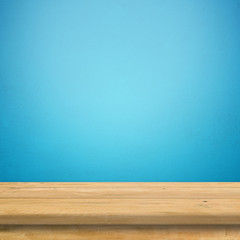 Vintage wood table in blue wall room.