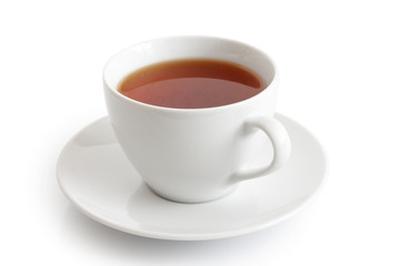 White ceramic cup and saucer with rooibos tea. Isolated.