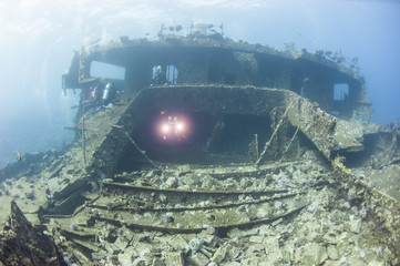 Diver exploring a large shipwreck