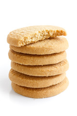 Stack of round shortbread biscuits isolated on white. Half biscu - obrazy, fototapety, plakaty