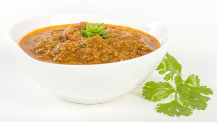 Baigan Bharta - Roasted mashed aubergines cooked with onions, tomatoes and spices. 

