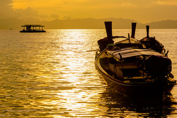Fishing boat floating on the sea at dawn.