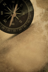 Fototapeta na wymiar compass in vintage style on mulberry paper texture 