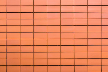 Texture of orange decorative tiles in form of brick
