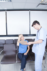 Fototapeta premium Male nurse helping a woman