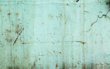 A background of peeling paint and rusty old metal