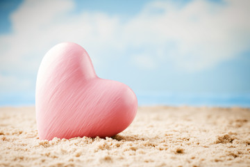 Heart on the sand on the seashore.