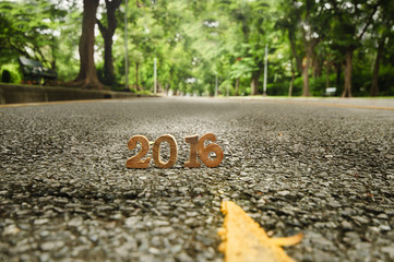 Head to New Year 2016 on road concept, wood number idea