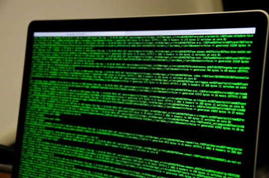 Mac Compute with green lines of code