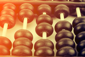 Vintage style - Close up of a wooden abacus beads. Selective foc