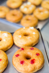 doughnuts with assorted filling on metal tray