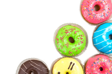 Fototapeta premium assorted glazed doughnuts in different colors