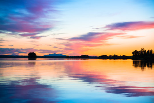 Fototapeta colorful sunset over a calm lake