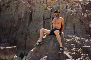 A man sitting on a rock