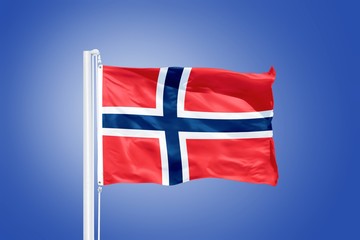 Flag of Norway flying against a blue sky