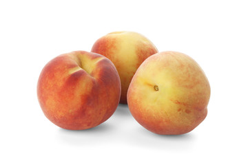 Fototapeta na wymiar Three ripe peach on a white background
