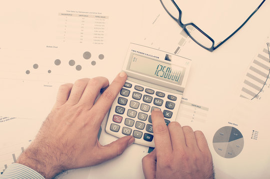 Businessman checking charts and statistics