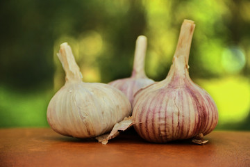 Three cloves of garlic on table